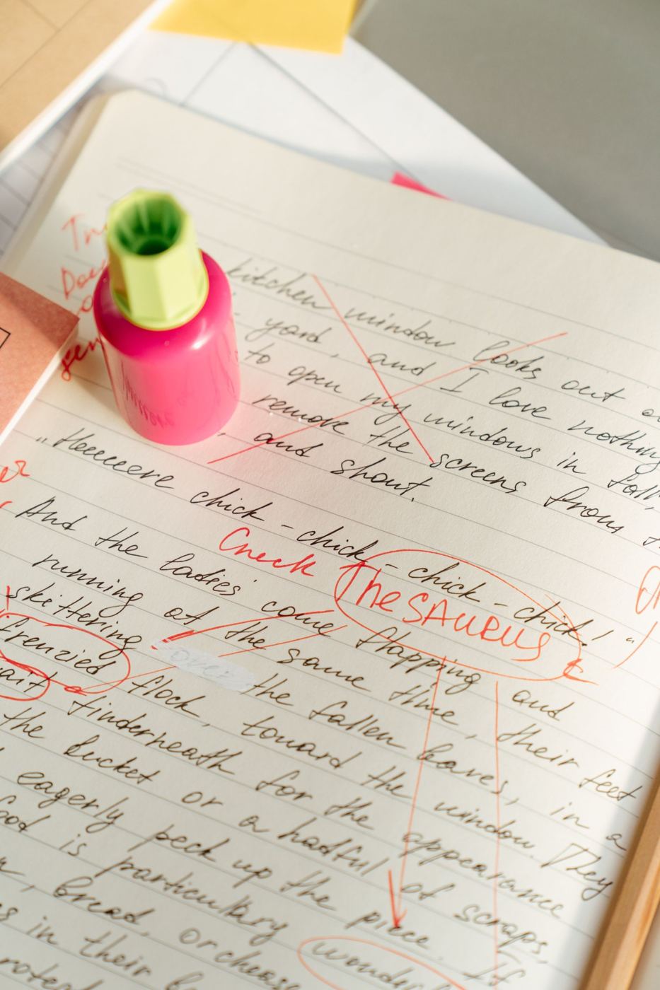 A handwritten draft with red edits and circled words